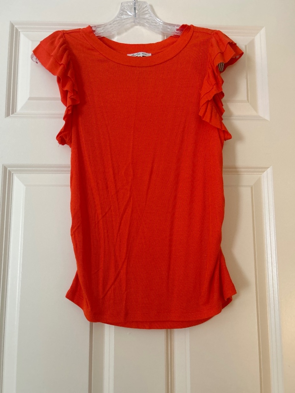 Woman orange ruffle blouse